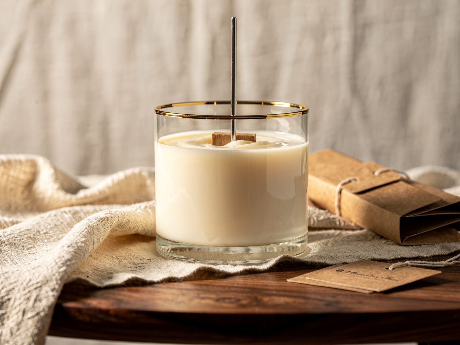 A hand-poured candle in the Claudi's Mossel Bay studio